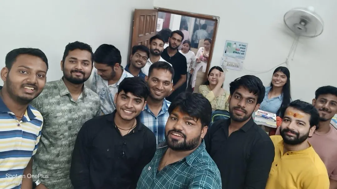 A group of students standing shoulder to shoulder indoors for a photograph